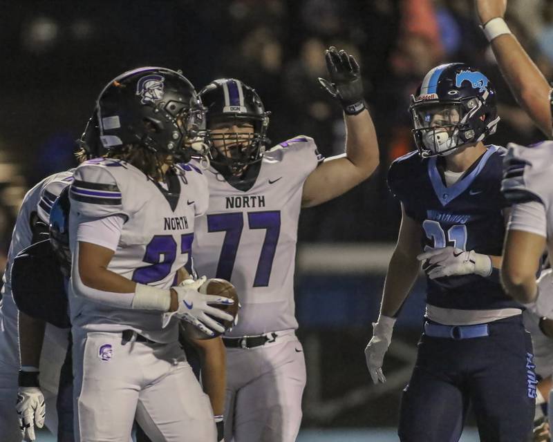 Downers Grove North's Kevin Jay Jr. (27) celebrates his touchdown run during football game between Downers Grove North at Downers Grove South Friday, Sept 5, 2025  in Downers Grove.