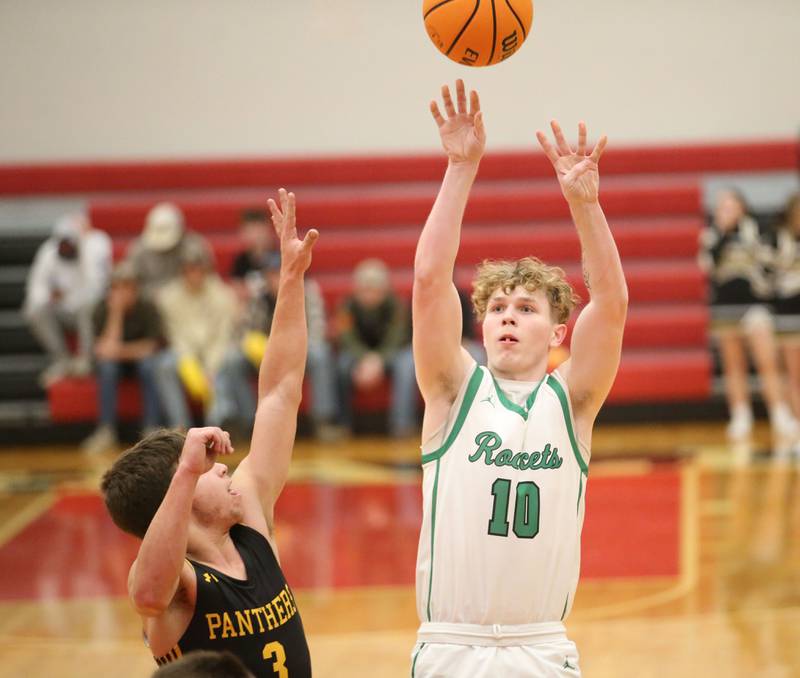 Rock Falls's Austin Castaneda eyes the hoop against Putnam County's AJ Furar during the 50th annual Colmone Classic on Monday, Dec. 9, 2024 at Hall High School.
