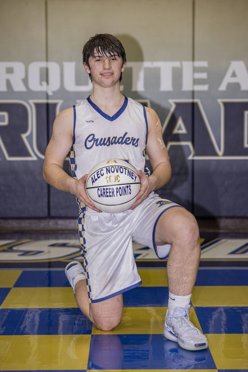 Alec Novotney poses with the commemorative basketball that he was given for scoring his 1000th point during the game against Henry-Senachwine on February 7, 2025 at Bader Gym.