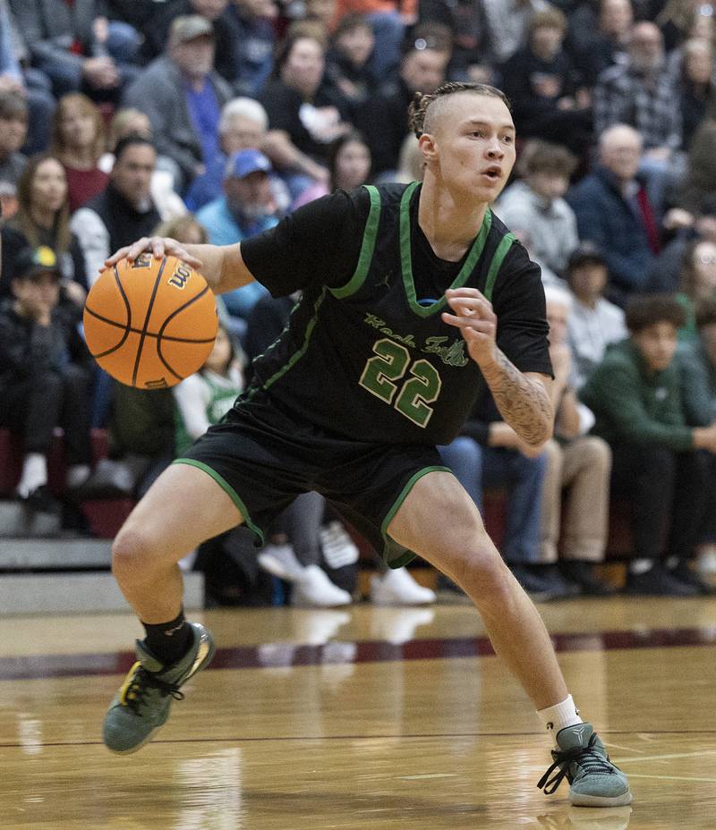 Rock Falls’ Nehemiah Menendez handles the ball against Winnebago Tuesday, March 4, 2025, during the 2A boys basketball Sectional final at Marengo.