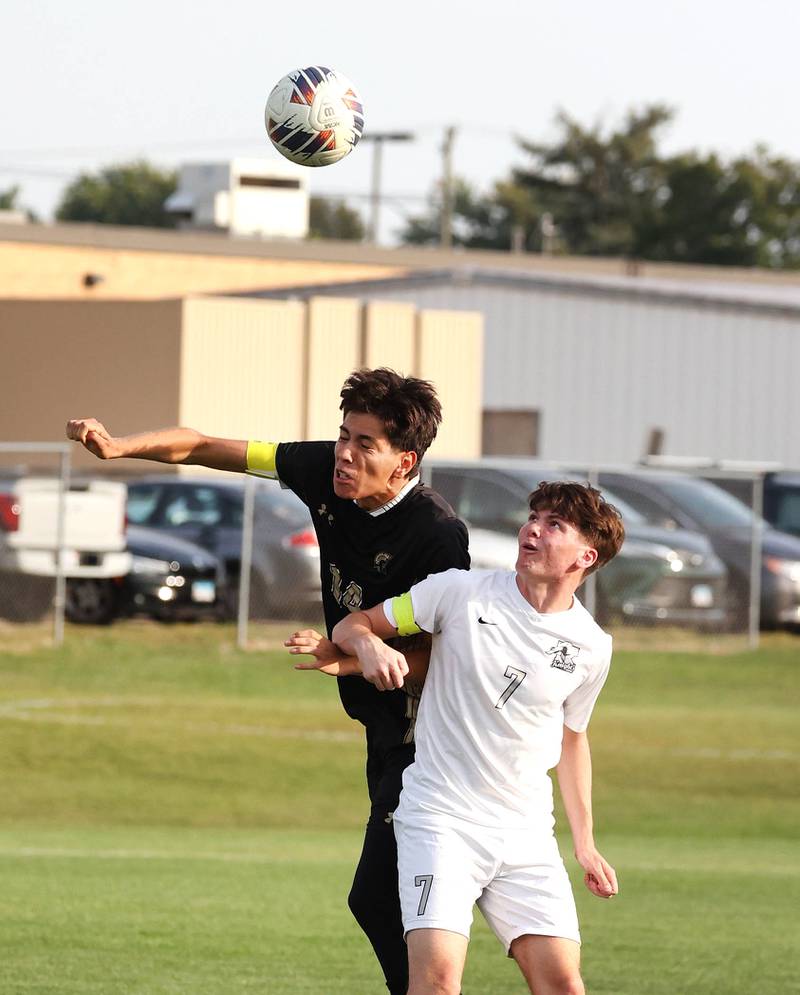 Sycamore's Javier Lopez (left) and Kaneland's Cameron Guernon head a ball during their game Wednesday, Sept. 18, 2024, at Sycamore High School.