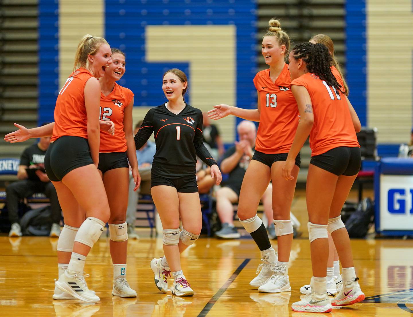 Wheaton Warrenville South players celebrate after defeating Geneva in a volleyball match at Geneva High School on Tuesday, Sep 5, 2023.