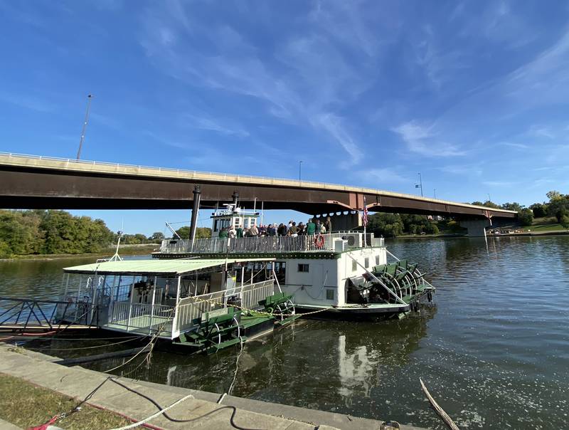 Gentry Nordstrom and Nathan Weiss show ribbon cutting attendees the top deck of the Sainte Genevieve.