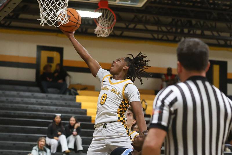 Joliet West’s Aamir Shannon lays in a shot against Kankakee on Wednesday, Feb. 18, 2026 in Joliet.