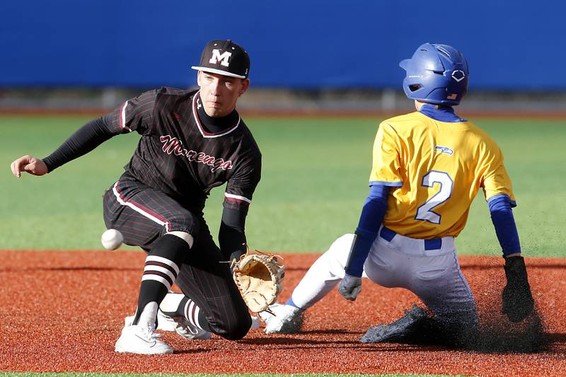 Marengo's Robert Heuser fields the throw to second base and Johnsburg's Riley Johnson slides into the base during a Kishwaukee River Conference baseball game  on Monday, April 21, 2025, at Johnsburg High School.