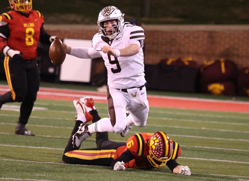 Mount Carmel's Jack Elliott is tripped up by Batavia's Tony Minnec during their Class 8A state championship game Saturday, Nov. 30, 2024, in Hancock Stadium at Illinois State University in Normal.