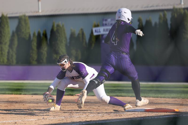 Manteno's Macy Iwanus catches an out at first base ahead of Wilmington's Madisyn Rossow during the Panthers' 9-7 victory over the Wildcats on Tuesday, April 8, 2025.