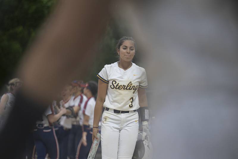 Sterling’s Lily Cantu walks back to the dugout after the Warriors’ lost to Belvidere North 4-0 Friday, May 30, 2025, in the Class 3A Regional final in Dixon.