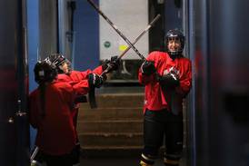 Photos: NIU hockey team teaches sport at camp in Geneva