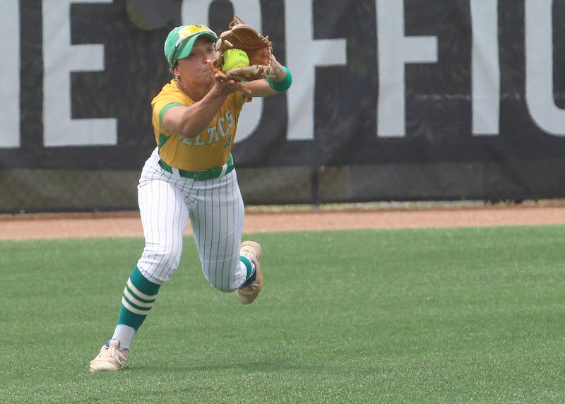 Providence Catholic's Angelina Cole squeezes the glove while making a catch on the run during the Class 3A State finals game on Saturday, June 14, 2025 at the Louisville Slugger Sports Complex in Peoria.