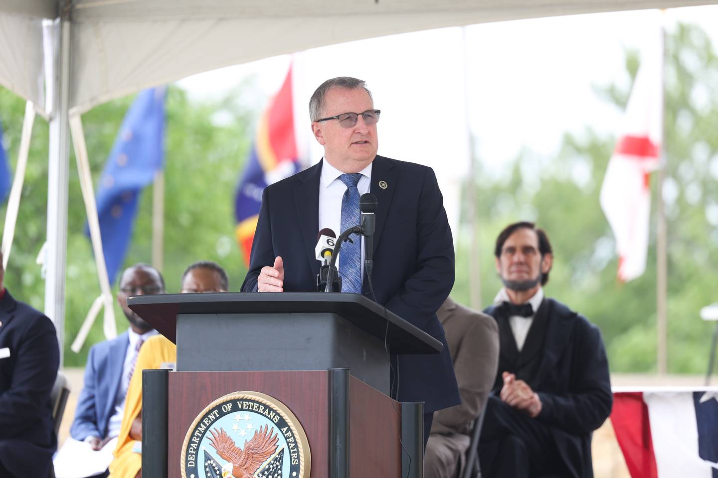 Matthew Quinn, Under Secretary of Memorial Affairs, speaks at the National Cemetery Administration 50th Anniversary ceremony at the Abraham Lincoln National Cemetery in Elwood on Saturday, July 29.