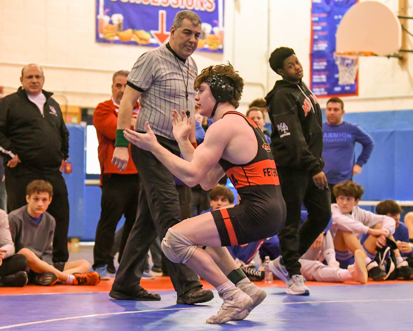 Kaden Fetterolf of Batavia celebrates after winning the 152-pound championship match at Saturday's Class 3A Marmion Regional.