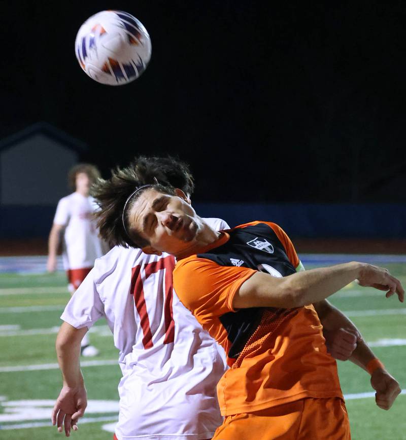 Hersey's Ray Reyes heads the ball away from Hinsdale Central's Antonio Azzo Friday, Nov. 8, 2024, during their Class 3A state semifinal game at Hoffman Estates High School.