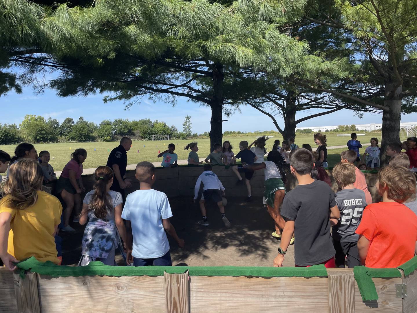 Officer Mark Vanderploeg plays Gaga ball with a group of fourth graders