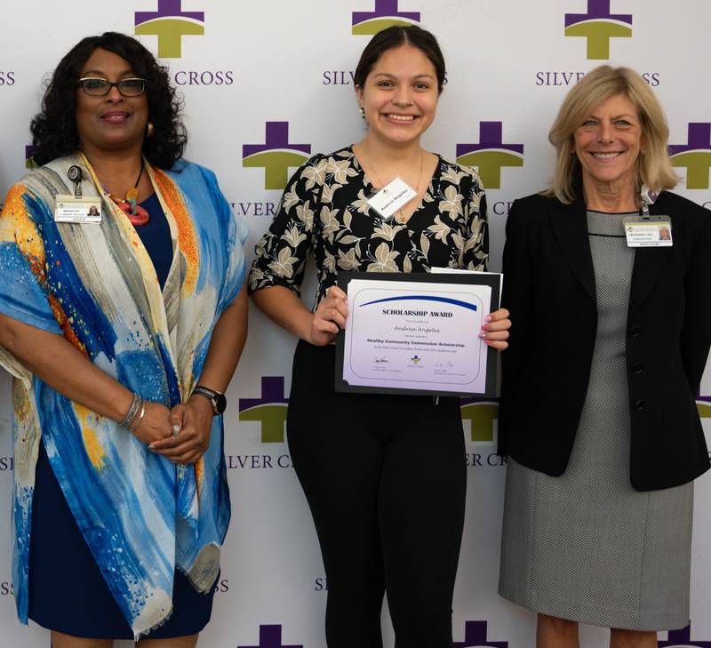 Andrea Angeles (center) receives a 2023 scholarship from the Silver Cross Healthy Community Commission. Angeles is pictured with Ruth Colby, Silver Cross president and chief executive officer (right) and Leslie Newbon, Silver Cross manager of marketing and community relations.