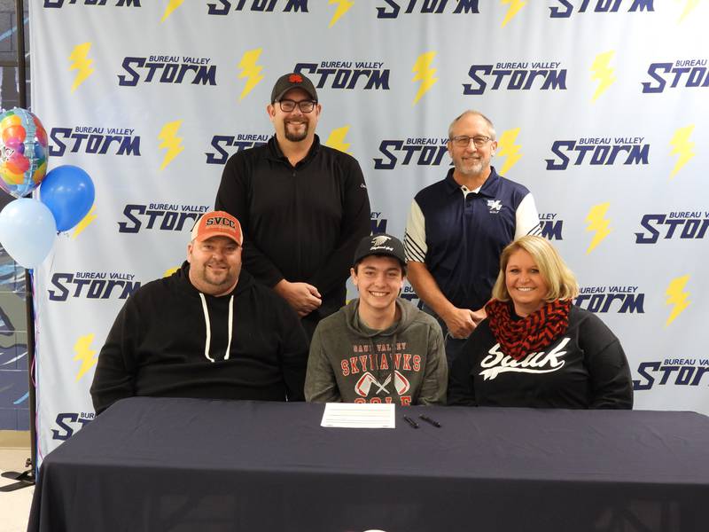 Bureau Valley senior Bryson Smith signed to play golf at Sauk Valley Community College Wednesday evening. He is pictured (front) with his parents Jason and Jamie Smith of Wyanet; and (back row) SVCC golf coach C.J. Wade and BV coach Jack Gustafson.