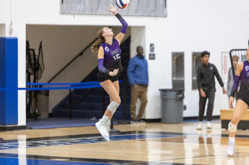 Downers Grove North's Madi Mastalarz serves the ball against St. Charles North on Thursday Oct. 23, 2025 in St. Charles.