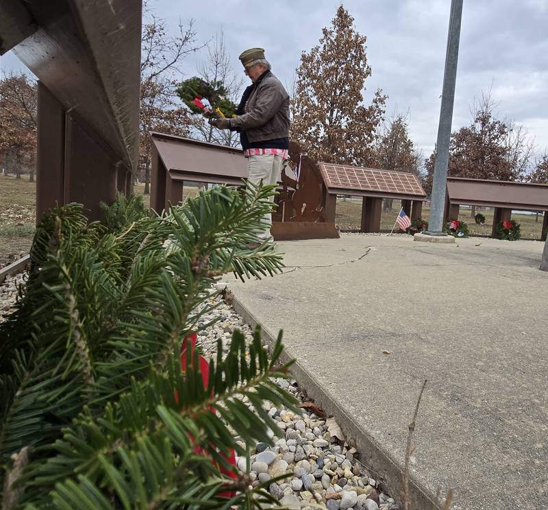 Volunteers lay wreaths Saturday, Dec. 14, 2024, at the Illinois Fallen Soldiers Tree Memorial during Wreaths Across America.