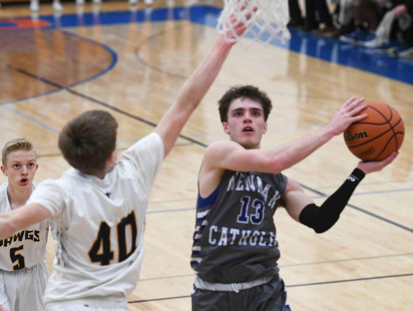 Newman's Nolan Britt drives to the basket during regional action against Freeport Aquin.