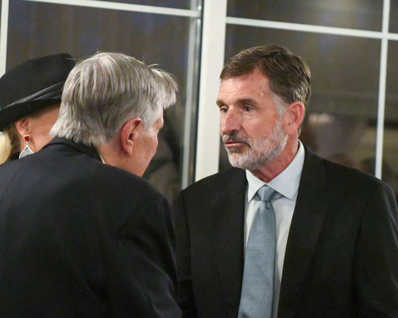 Charlie Murphy, right, the 2025 Charlemagne Award winner, congratulates Harrison Schneider after he was named this year's honoree Friday May 1, 2026.