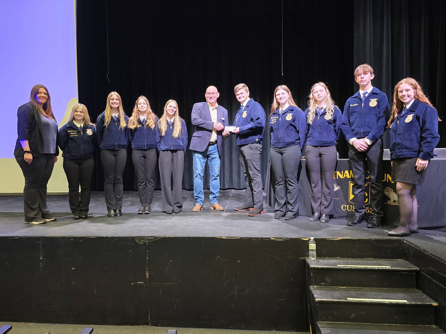 Putnam County FFA receives a $100 donation from Corn Belt Ports. The Putnam County Rotary donated the funds to Corn Belt Ports, which passed it along to the FFA.
