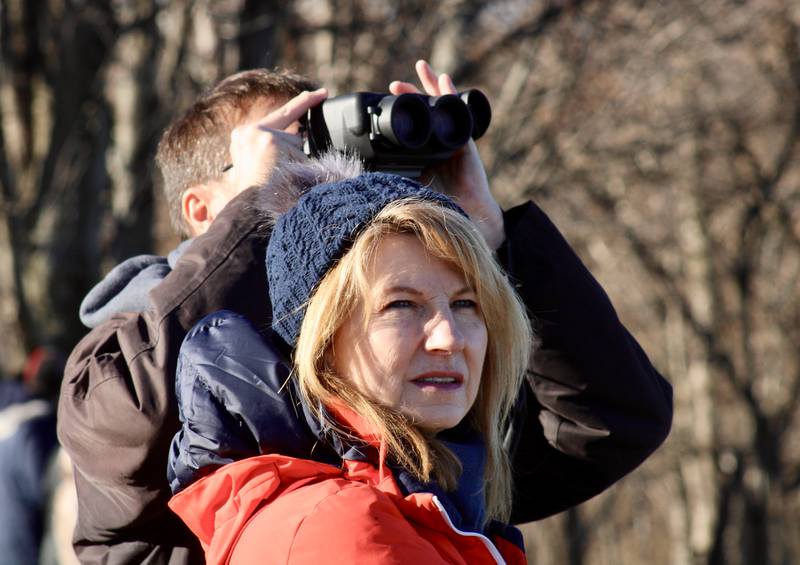 Mark Petri of Lemont and Jill Lucas of Hammond, Indiana, have their eyes trained on the sky in the hopes of viewing an eagle during Flock to the Rock on Saturday, Feb. 11, 2023, at Lower Dam Park in Rock Falls.