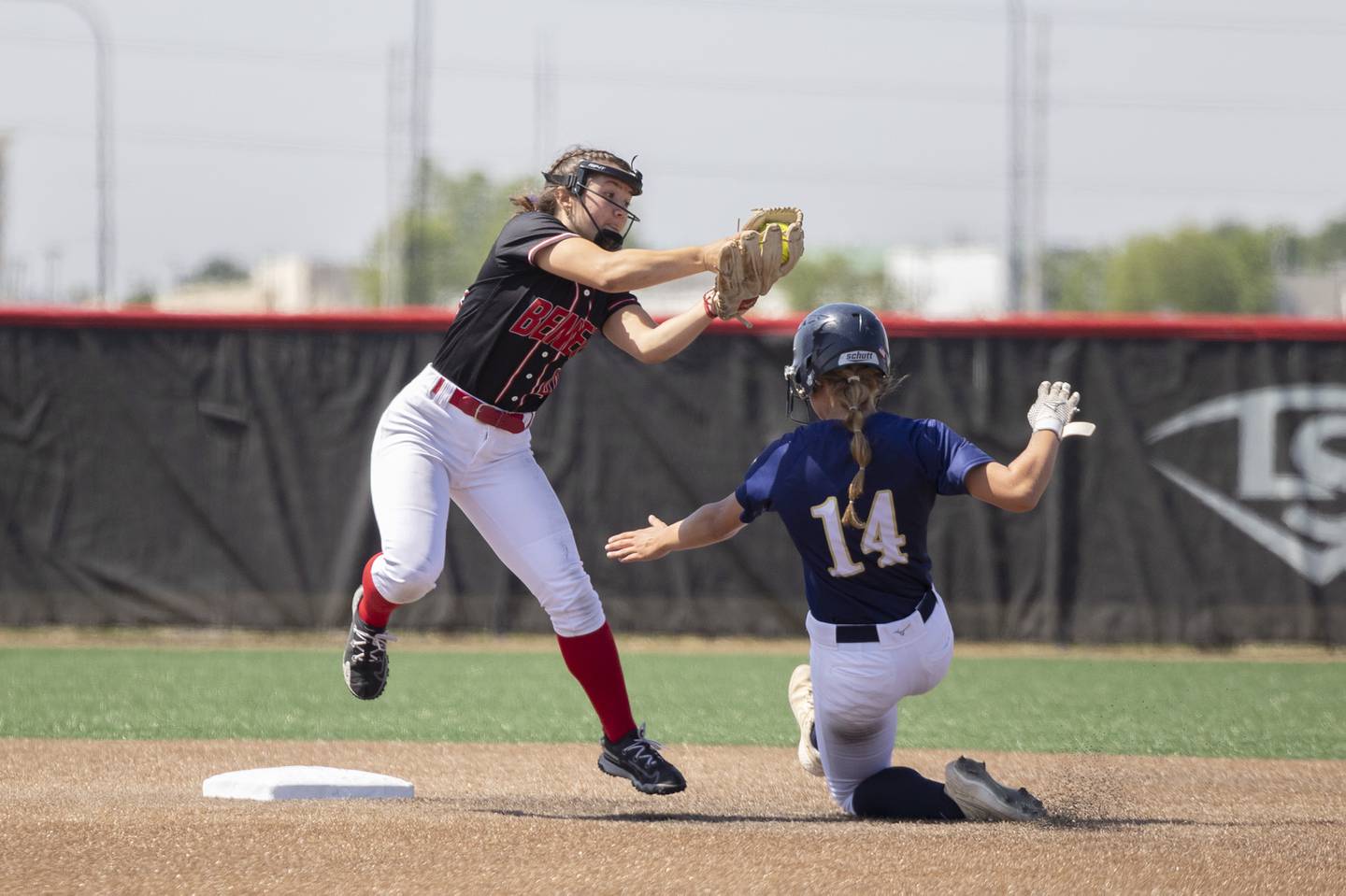 Benet Academy’s Angela Horejs goes to the tag on a steal by Lemont’s Olivia Parent Friday, June 9, 2023 in the class 3A state softball semifinal.
