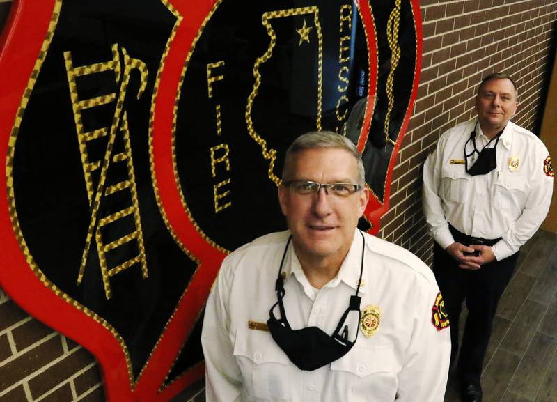 McHenry Township Fire Protection District Chief Tony Huemann, front and Deputy Chief Rudy Horist pose for a portrait on Tuesday, Jan. 5, 2021 in McHenry. Huemann is retiring Thursday and Horist will take over as Chief on Friday.