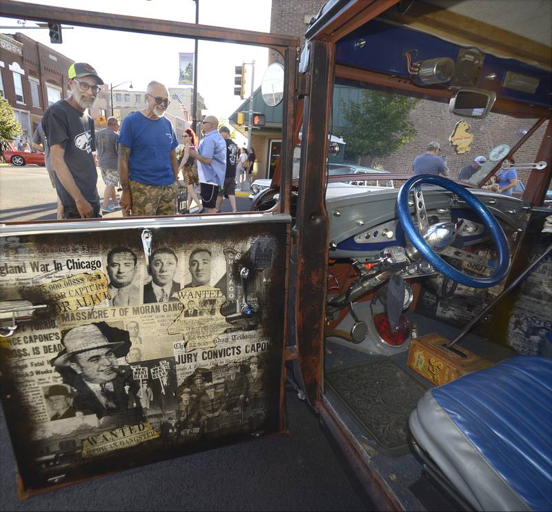 his customized 1930’s era police car drew much attention during the annual Cruise Night Saturday in Streator.  Hosted by Dream Machines Car Club, the event drew thousand to downtown Streator.