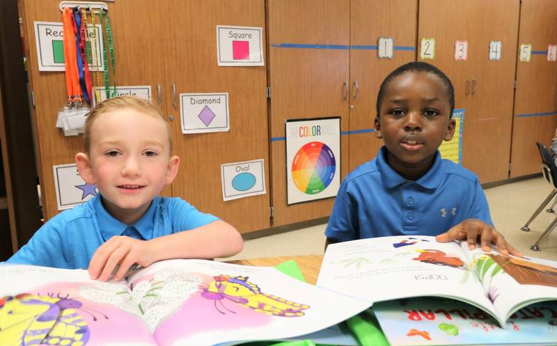 The Illinois nonprofit Bernie’s Book Bank donated books – again – to Joliet Public Schools District 86 students, Each student in preschool through sixth grade, including Thomas Jefferson Elementary kindergarten students (from left) Clayton Coote and Belden Akim, received eight books. Bernie’s Book Bank has donated books to Joliet District 86 students since 2015.