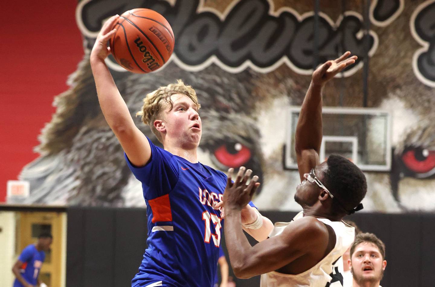 Genoa-Kingston's Hayden Hodgson goes strong to the basket against an Indian Creek defender Wednesday, Jan. 25, 2023, during their game at Indian Creek High School in Shabbona.