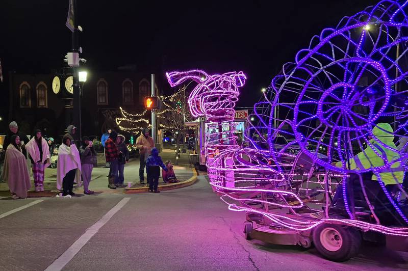 A lighted snail float cruises Saturday, Nov. 30, 2024, during the Lighted Christmas Parade in downtown Streator.