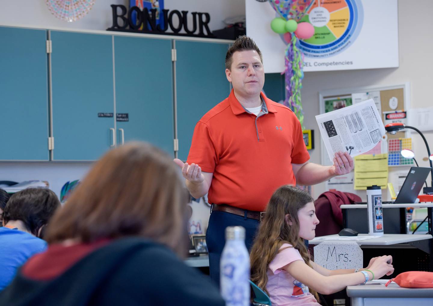 Patrick McGuire leads a seventh grade social studies class at Wredling Middle School on Tuesday, March 15, 2022.
McGuire, a former assistant principal, decided to return to the classroom this year at Wredling Middle School in St. Charles in order to reconnect with students.