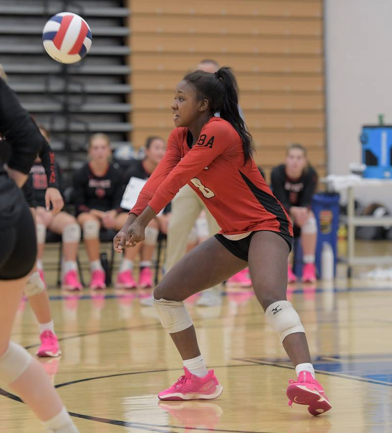 Benet's Aniya Warren (8) returns the ball against St. Charles North during a game on Wednesday, September 20, 2023.