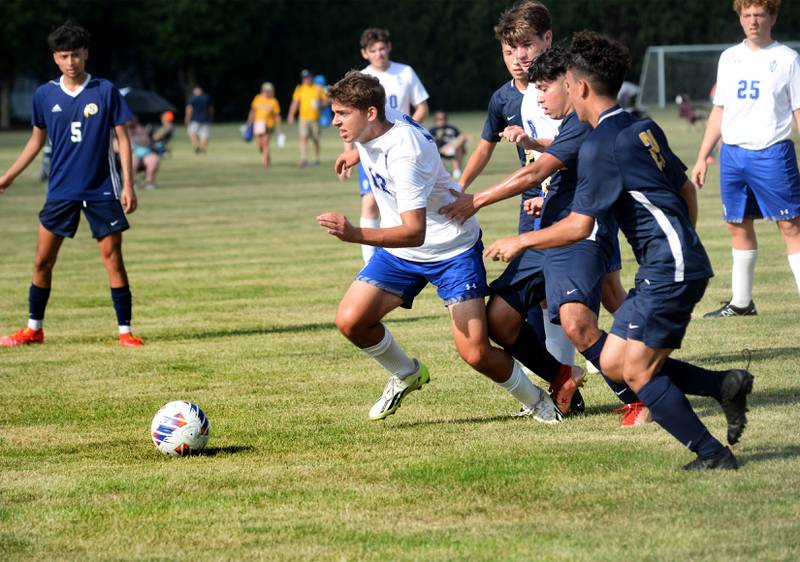 Princeton's Asa Gartin runs toward a ball as Sterling players give chase at the Oregon High School's Soccer Invitational on Friday, Aug. 25, 2023.