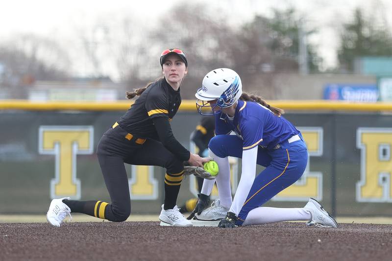 Joliet West’s Ella Featherston looks to the umpire for the call at second base against Sandburg on Thursday, March 12, 2026 in Joliet.