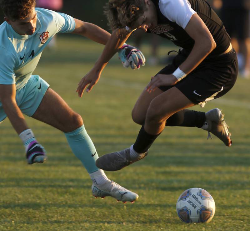 Crystal Lake Central's Anthony Bellino goes after the ball as the feet of Prairie Ridge's Henry Knoll during a Fox Valley Conference soccer match on Thursday, Oct. 10, 2024, at Prairie Ridge High School.