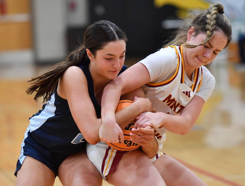 Nazareth’s Samantha Austin (left) and Montini’s Peyton Farrell tie up the ball during a Coach Kipp Hoopsfest game on January 20, 2025 at Benet Academy in Lisle.