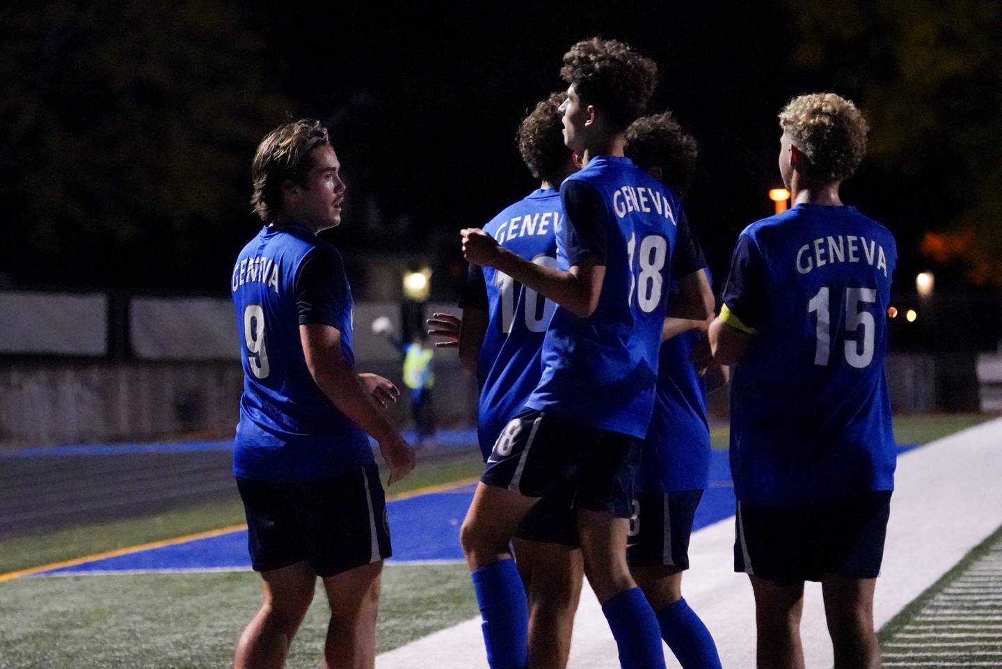 Geneva’s Caleb Kelly (9) is greeted by his team mates after scoring a goal on a header against St. Charles East's during a DuKane Conference game at Geneva High School on Tuesday, Oct. 14, 2025.