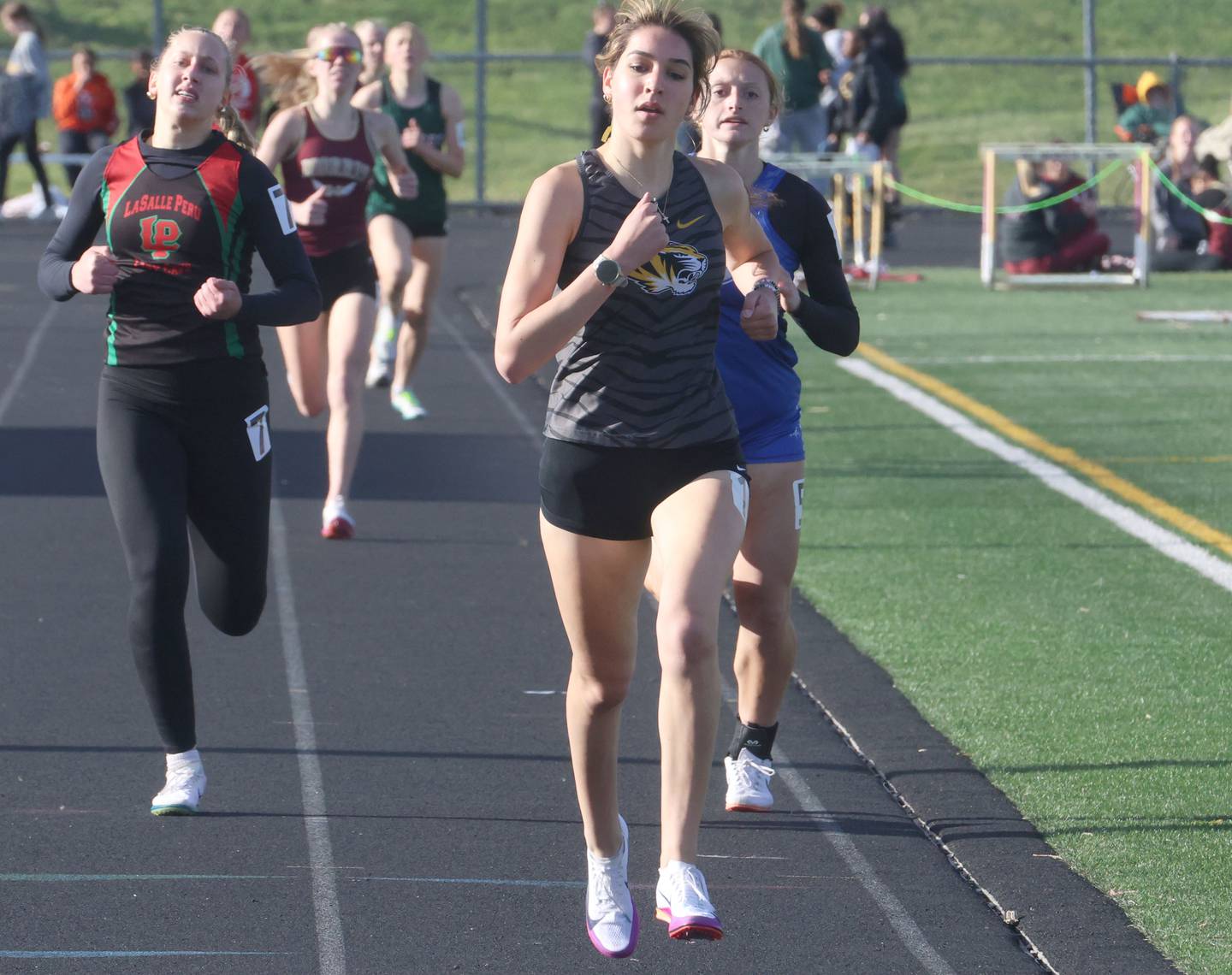 Herscher's Kelly O'Connor wins the 800 meter race as L-P's Aubrey Urbanski and Princeton's Jocelyn Strouss trail behind during the Class 2A Sectional track meet on Wednesday, May 13, 2026 in the Jeff Prusator Athletic Complex at Mendota High School.