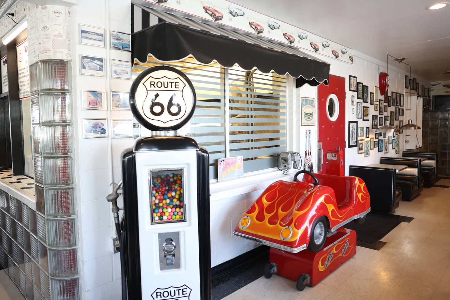 Route 66 memorabilia and nostalgic decor decorate The Polk-a-Dot Drive In in Braidwood.