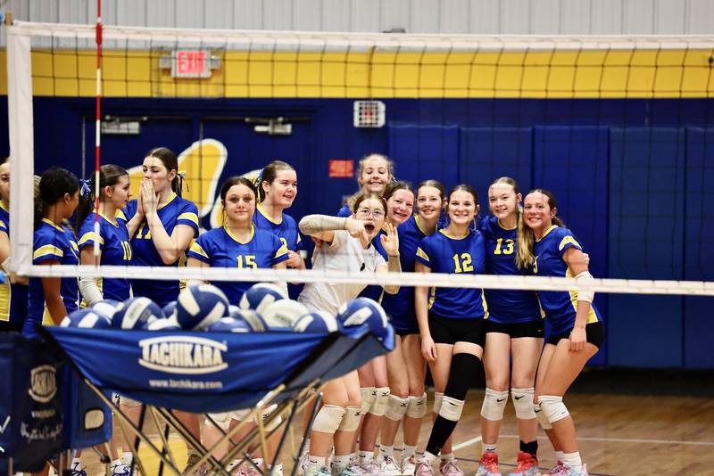 The Princeton Logan eighth-grade volleyball team hams it up for BCR photographer Mike Vaughn before their  IESA 3A regional match Saturday at Pannebaker Gym. They. defeated Rockford Kennedy to advance to the semifinals, which have been postponed from Tuesday to Wednesday due to the severe weather forecast.