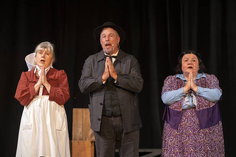 Jennifer Bakener (left), Mark Tremble and Natalie Coy rehearse their parts in PAG’s “Paint Your Wagon” on Monday, April 13, 2026. Show dates will be April 17-19 and 24-26 at the Allure of Pinecrest Theatre in Mount Morris. Friday and Saturday show times will be 7 p.m. and Sunday at 2 p.m.