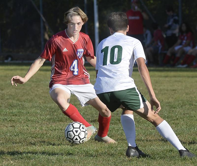 Streator’s Noah Russow (4) works to get past Coal City’s Caleb Figueroa (10) during first half of a match on Tuesday, Oct. 4, 2022 at Streator.