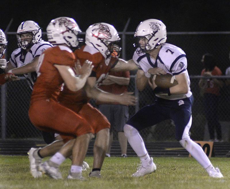 Streator defenders Christian Benning and Manny Villalobos team up to stop Lisle quarterback Max Etheridge (7) during the second quarter Friday, Sept. 16, 2022, at Doug Dieken Stadium in Streator.