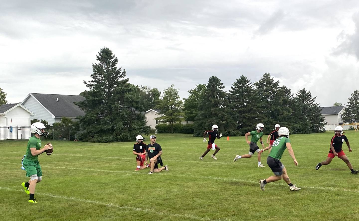 Dwight quarterback Collin Bachand drops back Tuesday, July 9, 2024, during a 7-on-7 scrimmage against Streator at Dwight High School.