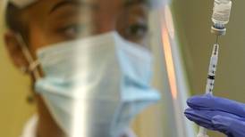 CDC leader adds people with risky jobs to COVID booster list