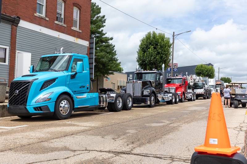 Semi Trucks line up on Main Avenue for the 21st annual Convoy Against Cancer on Saturday, July 19, 2025 in Ladd.