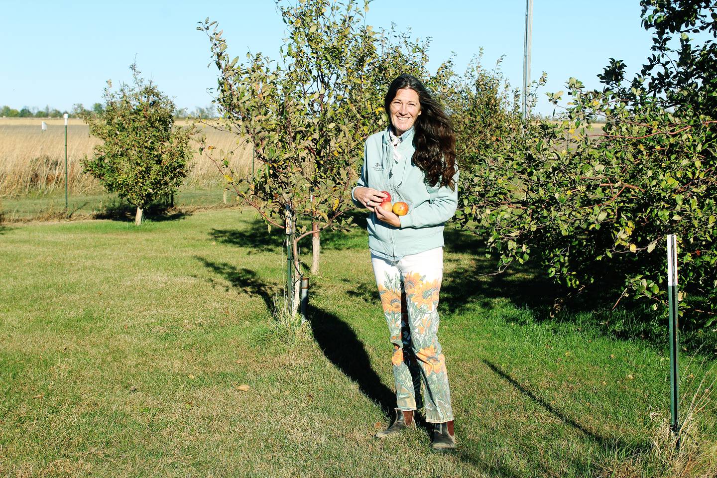 Lisa Ayers and her husband John own Nomia Meadows Farm north of Franklin Grove, where they preserve 110 acres of prairie, grow apples in an orchard and collect and sell honey from bees they raise.