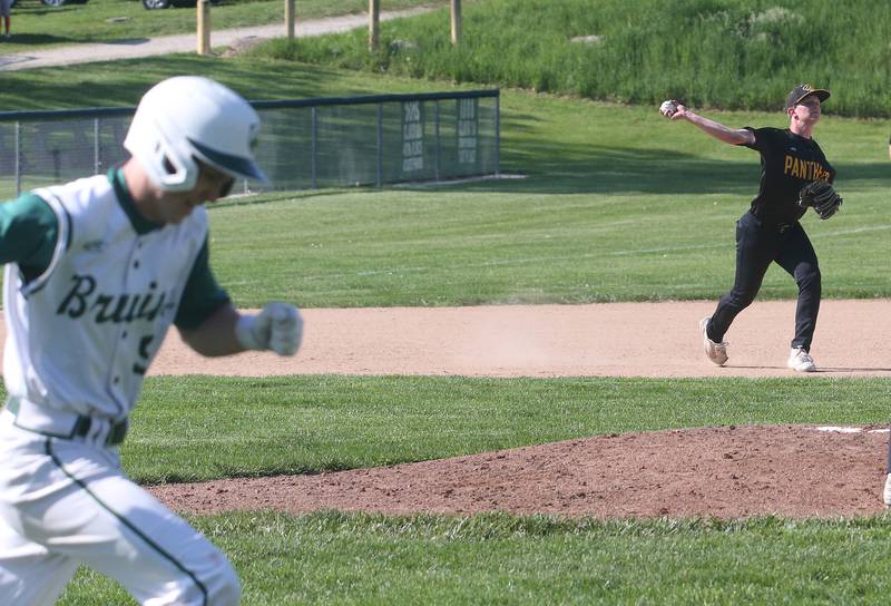 Putnam County's third baseman Kade Zimmerlein throws to first base to force out St. Bede's Geno Dinges on Thursday, May 8, 2025 at St. Bede Academy.